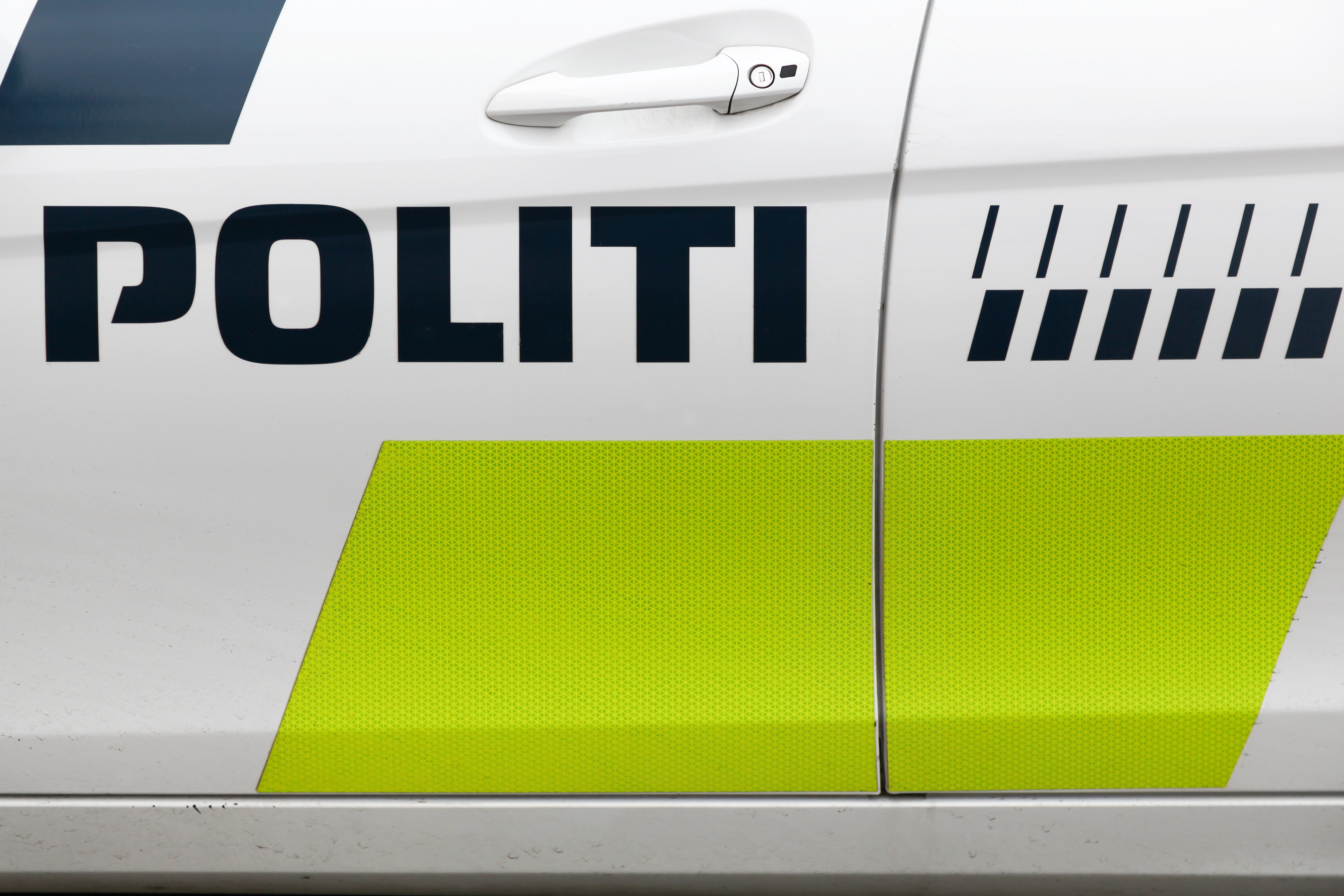 Danish police sign on a car